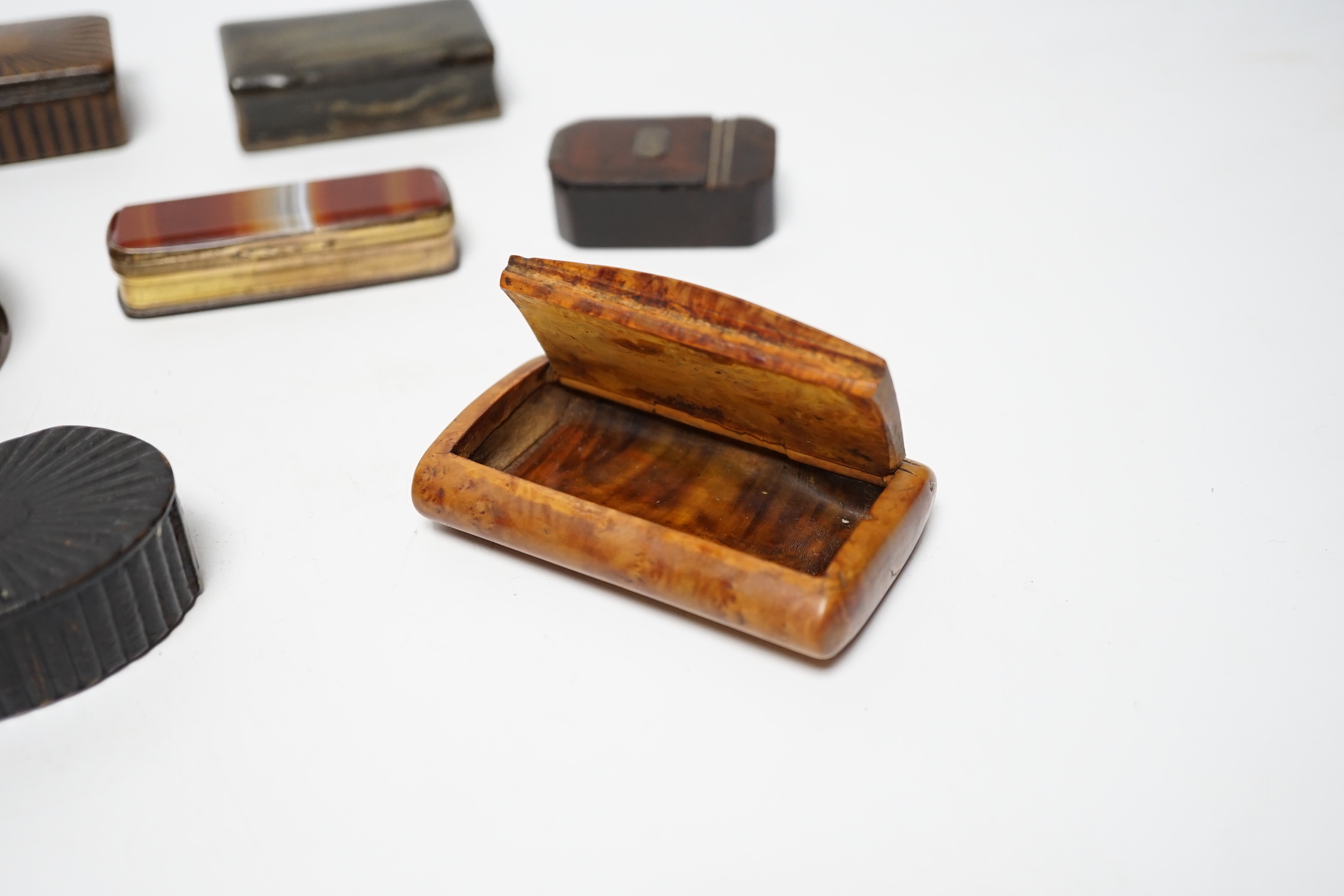 A collection of ten snuff boxes in tortoiseshell, treen or horn, etc.